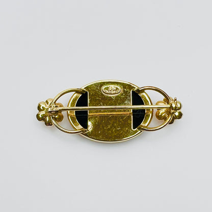 Back of brooch showing WRE 12K GF hallmark