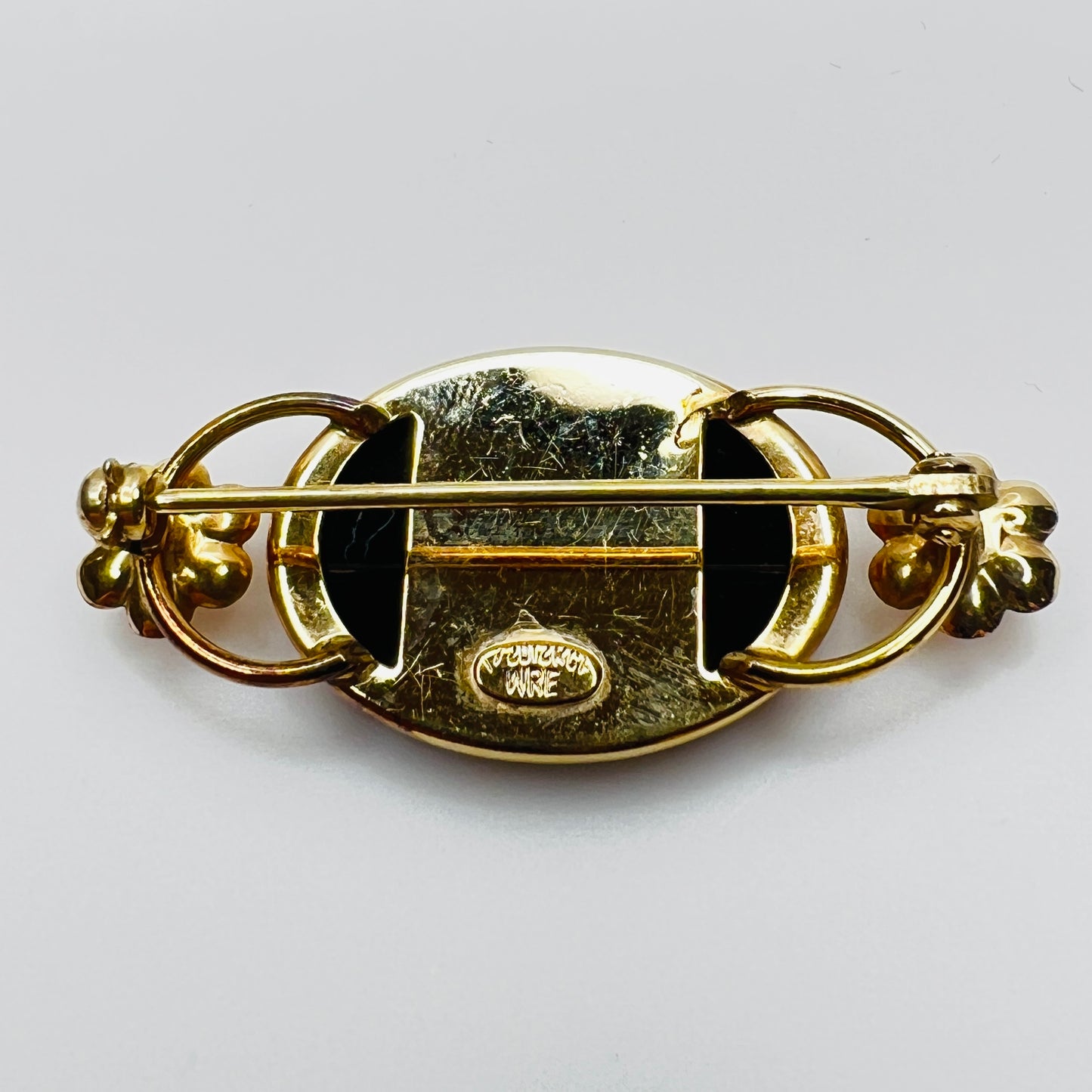 Back of brooch showing WRE 12K GF hallmark