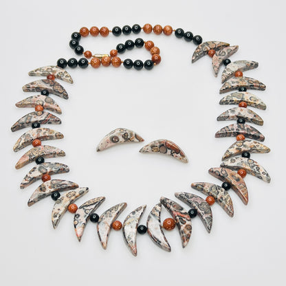 Necklace and matching earrings set laid flat