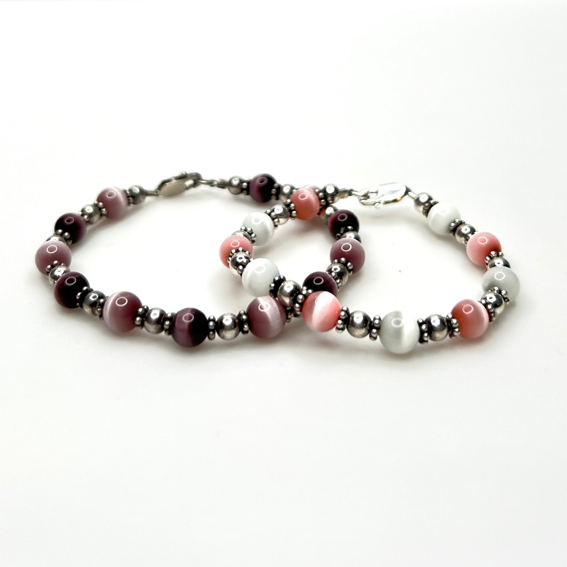 Vintage sterling silver cat's eye bead bracelet set in pink, purple, and white