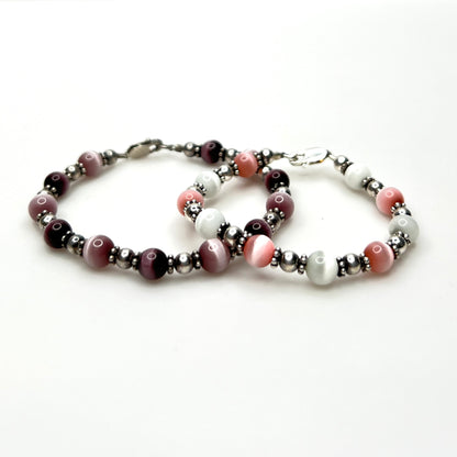Vintage sterling silver cat's eye bead bracelet set in pink, purple, and white
