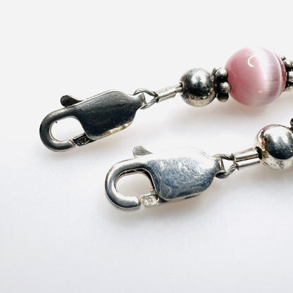 Close up of  925 mark on lobster claw clasp of sterling silver cats eye bracelets