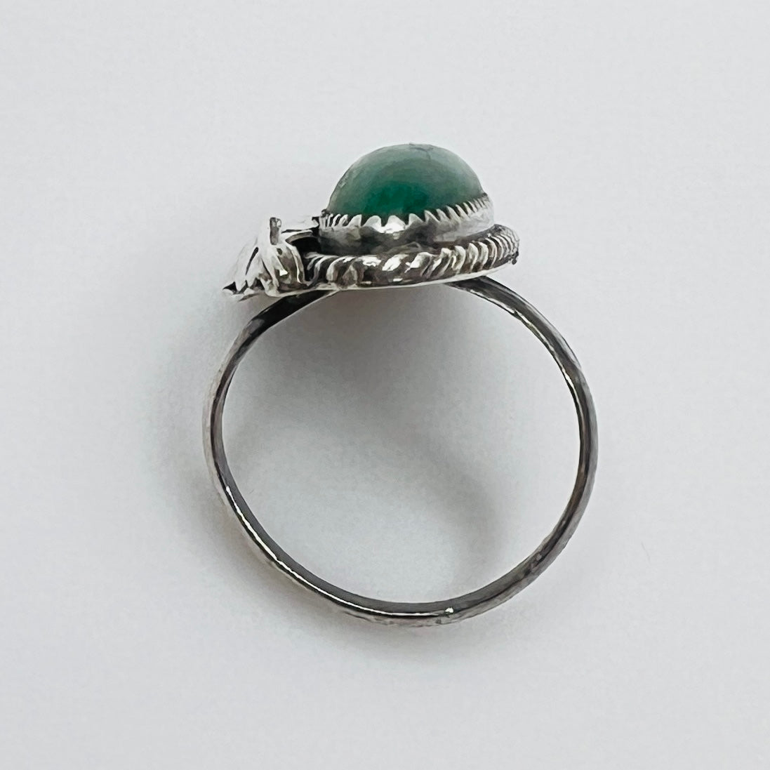 Profile of artisan silver ring with green malachite stone