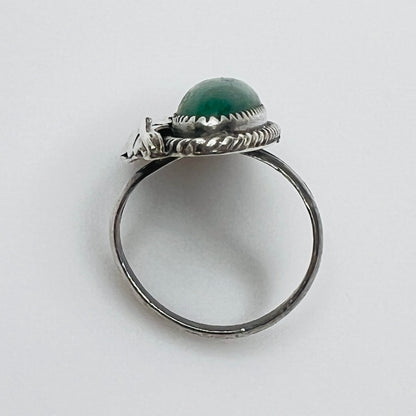 Profile of artisan silver ring with green malachite stone