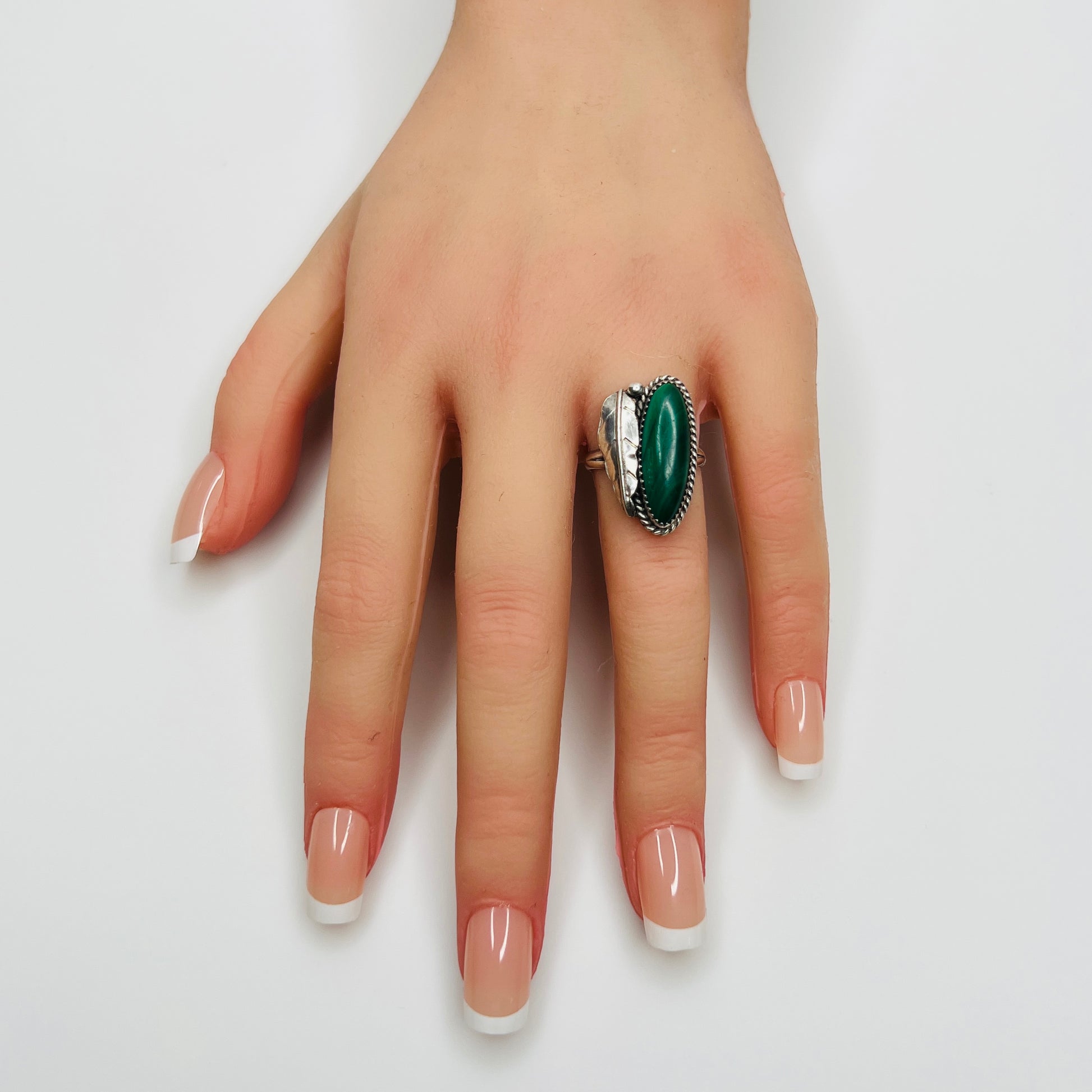 Malachite statement ring worn on hand marquise green cabochon