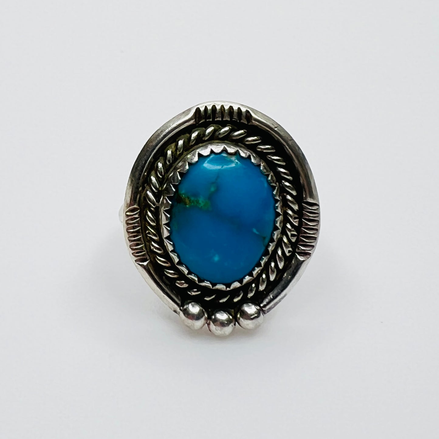 Vintage sterling silver ring with oval turquoise stone and rope border