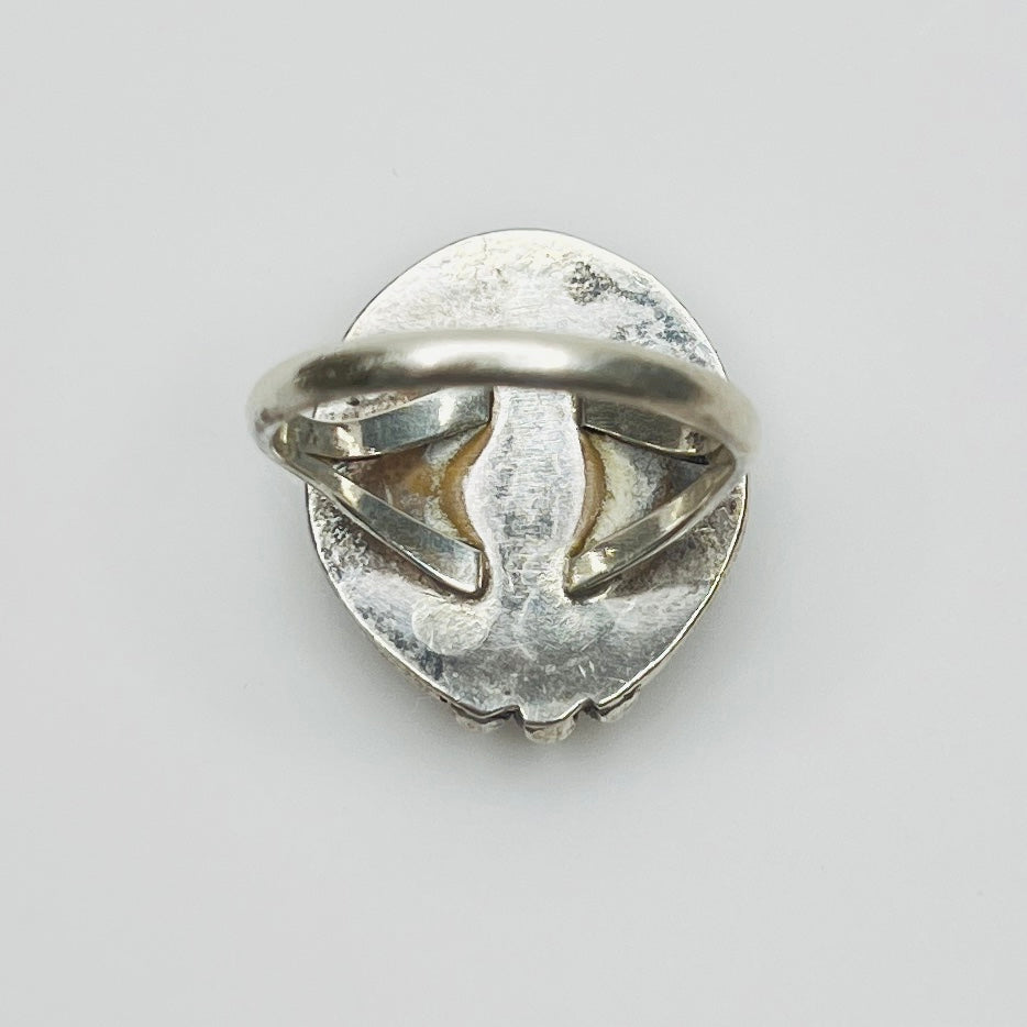 Back of vintage silver ring showing band and patina
