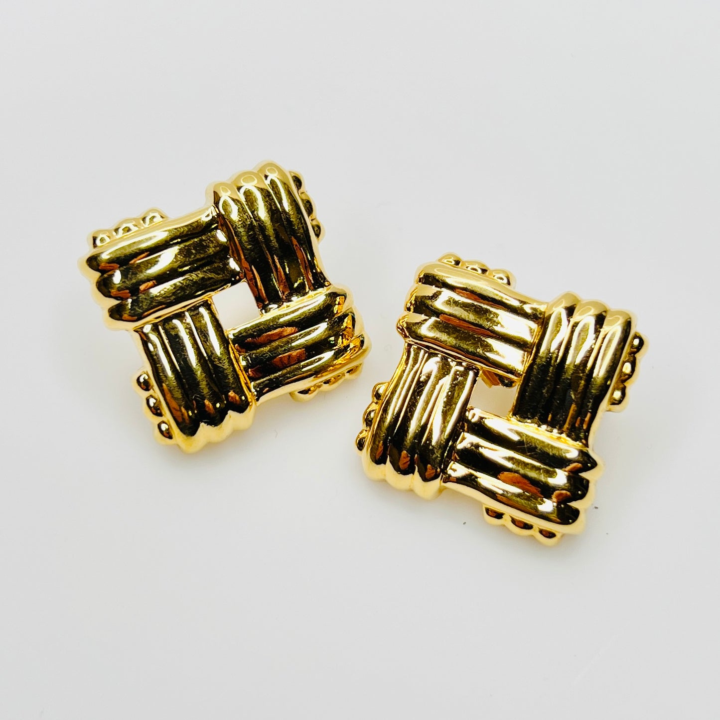 Vintage Avon gold tone basket weave stud earrings from the 1980s