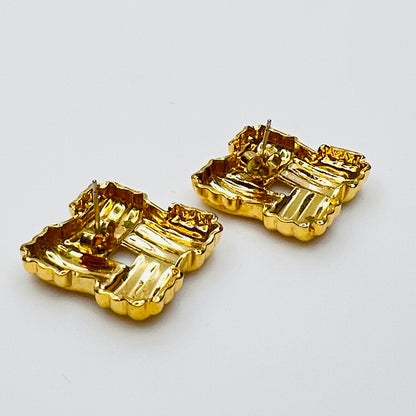 Back view of signed Avon gold tone basket weave earrings