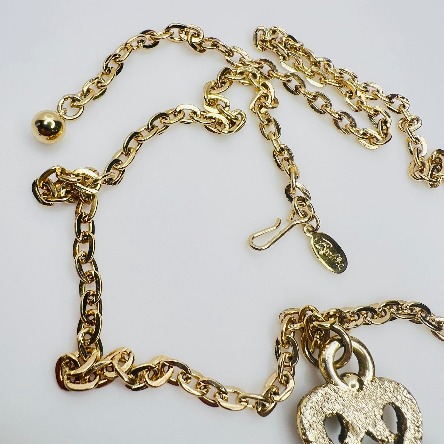 Beeline hang tag and clasp detail on gold tone chain