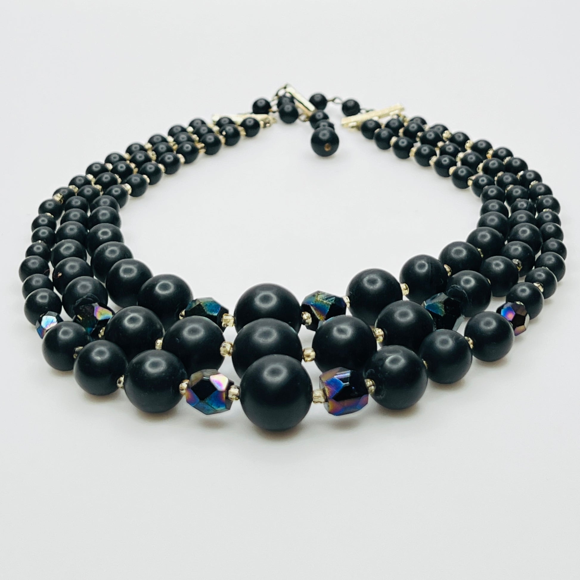 Layered matte black bead necklace with iridescent crystal accents