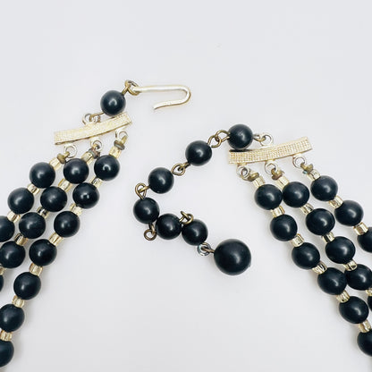 Clasp view of Layered matte black bead necklace with iridescent crystal accents