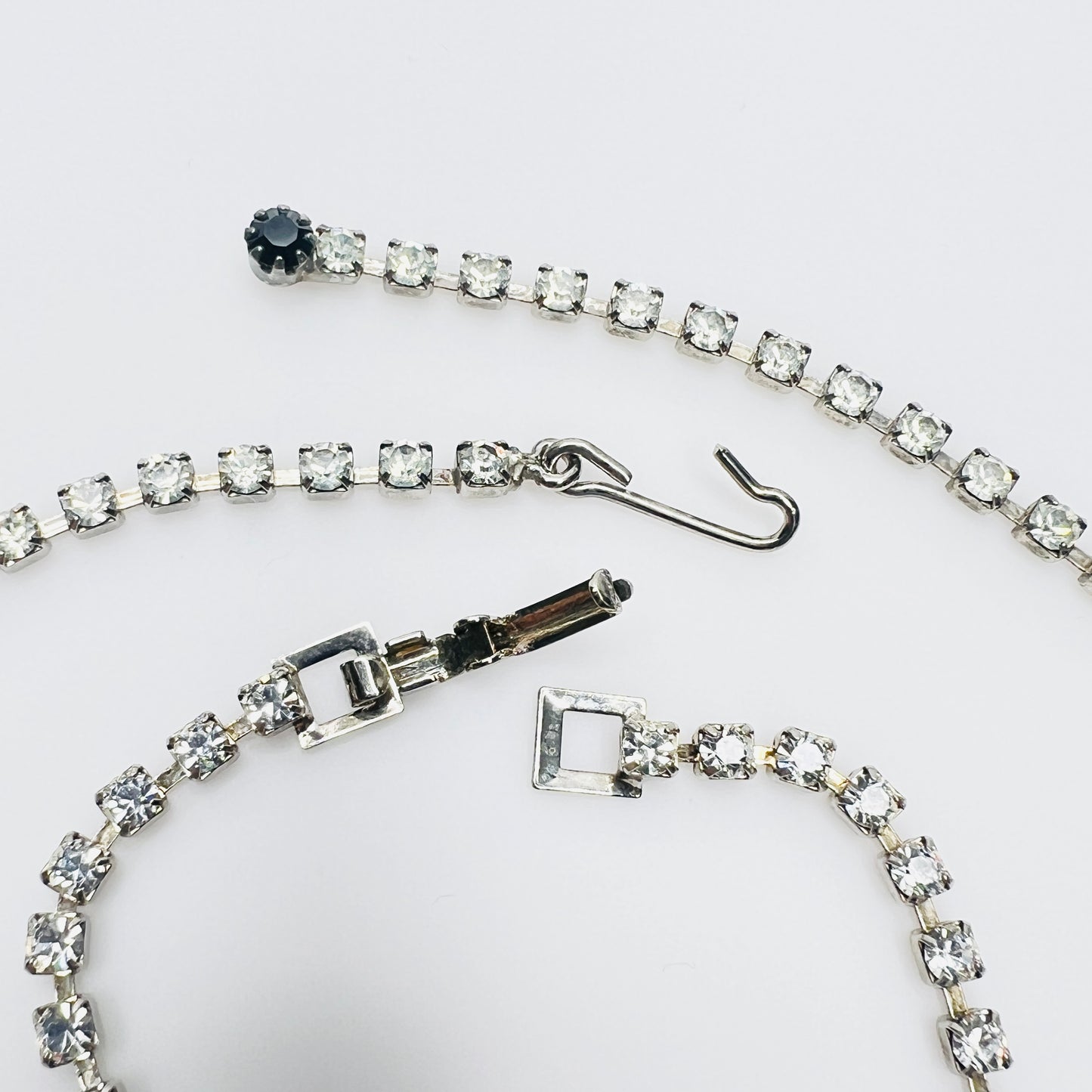 Close view of vintage rhinestone necklace and bracelet clasps