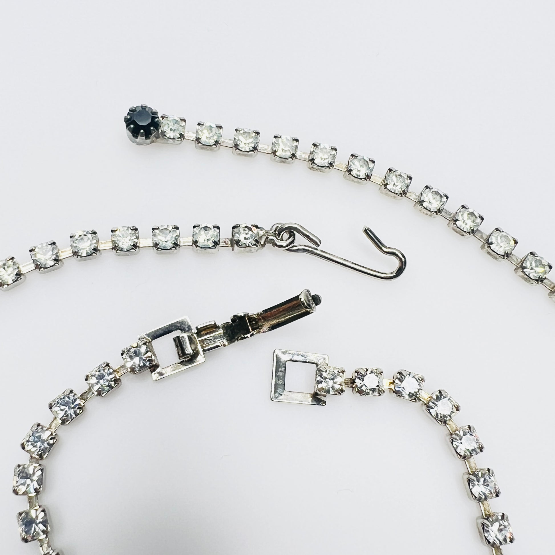 Close view of vintage rhinestone necklace and bracelet clasps