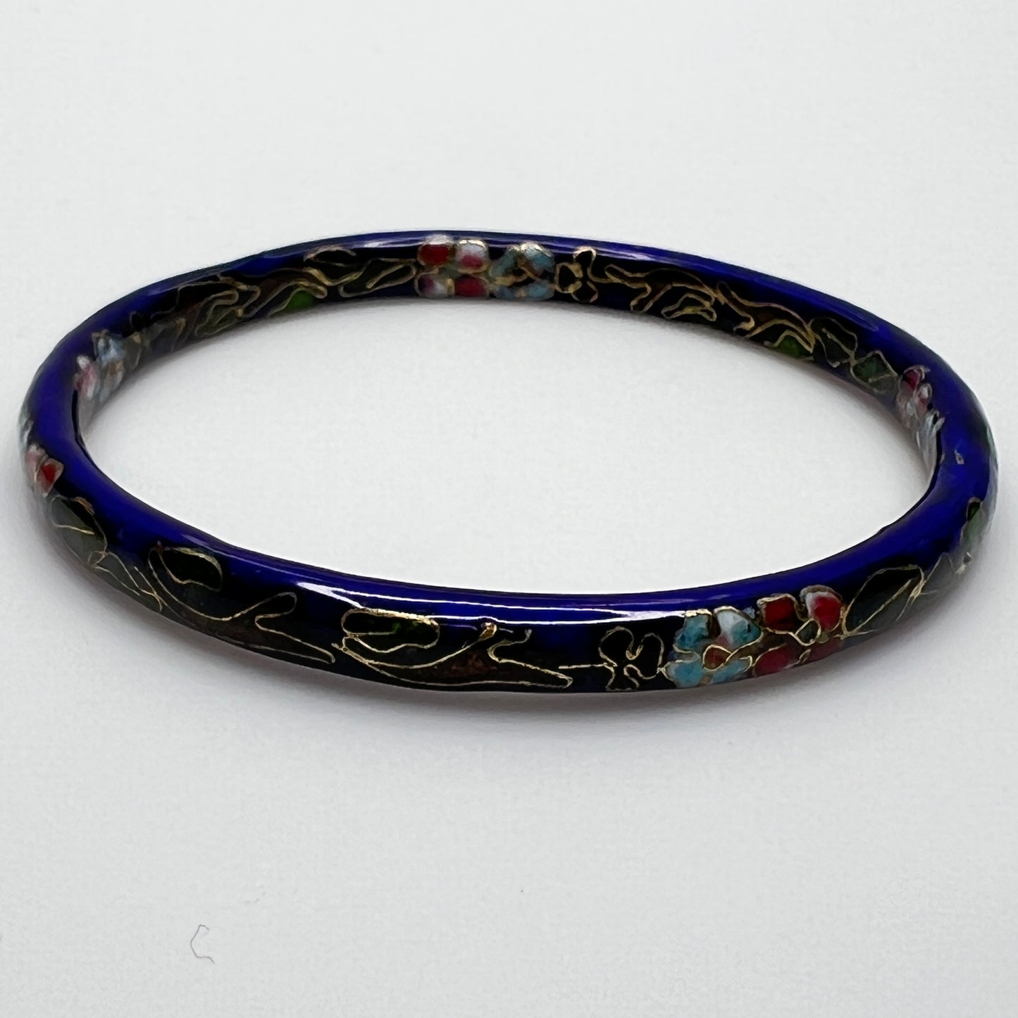Cloisonné skinny bangle in navy blue with pink and green flowers
