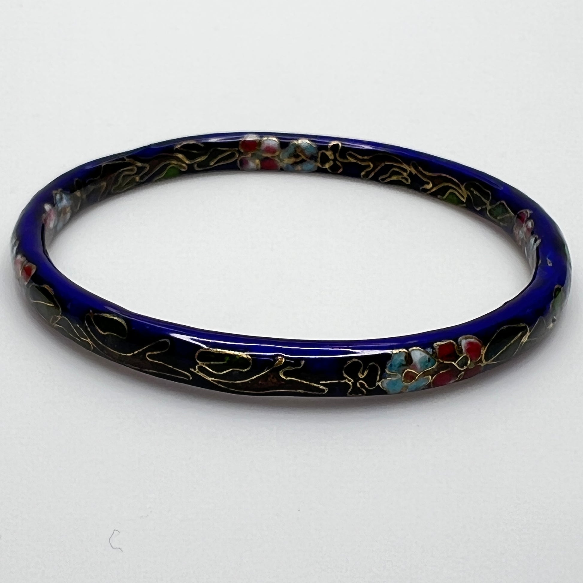 Cloisonné skinny bangle in navy blue with pink and green flowers