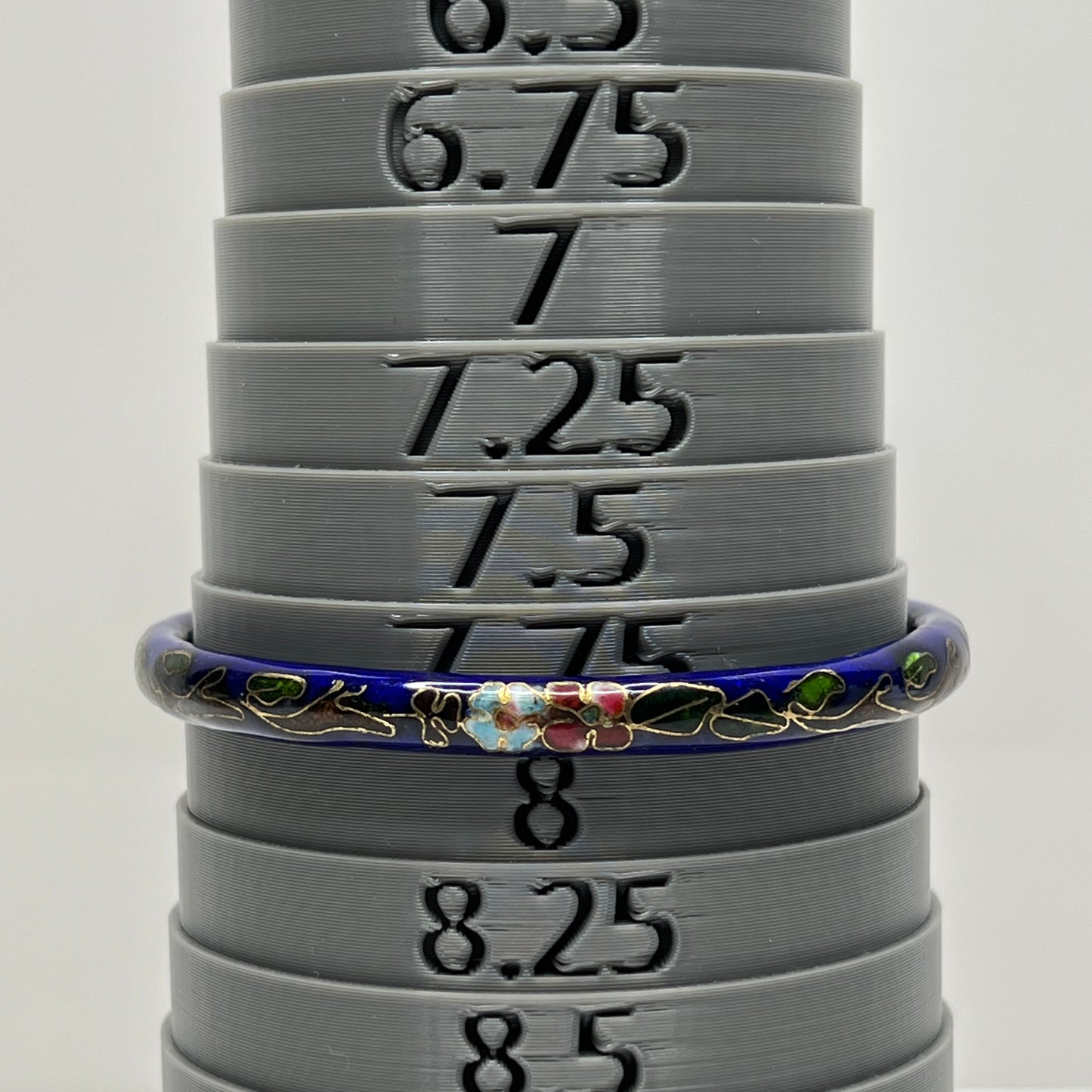 Cloisonné skinny bangle in navy blue with pink and green flowers