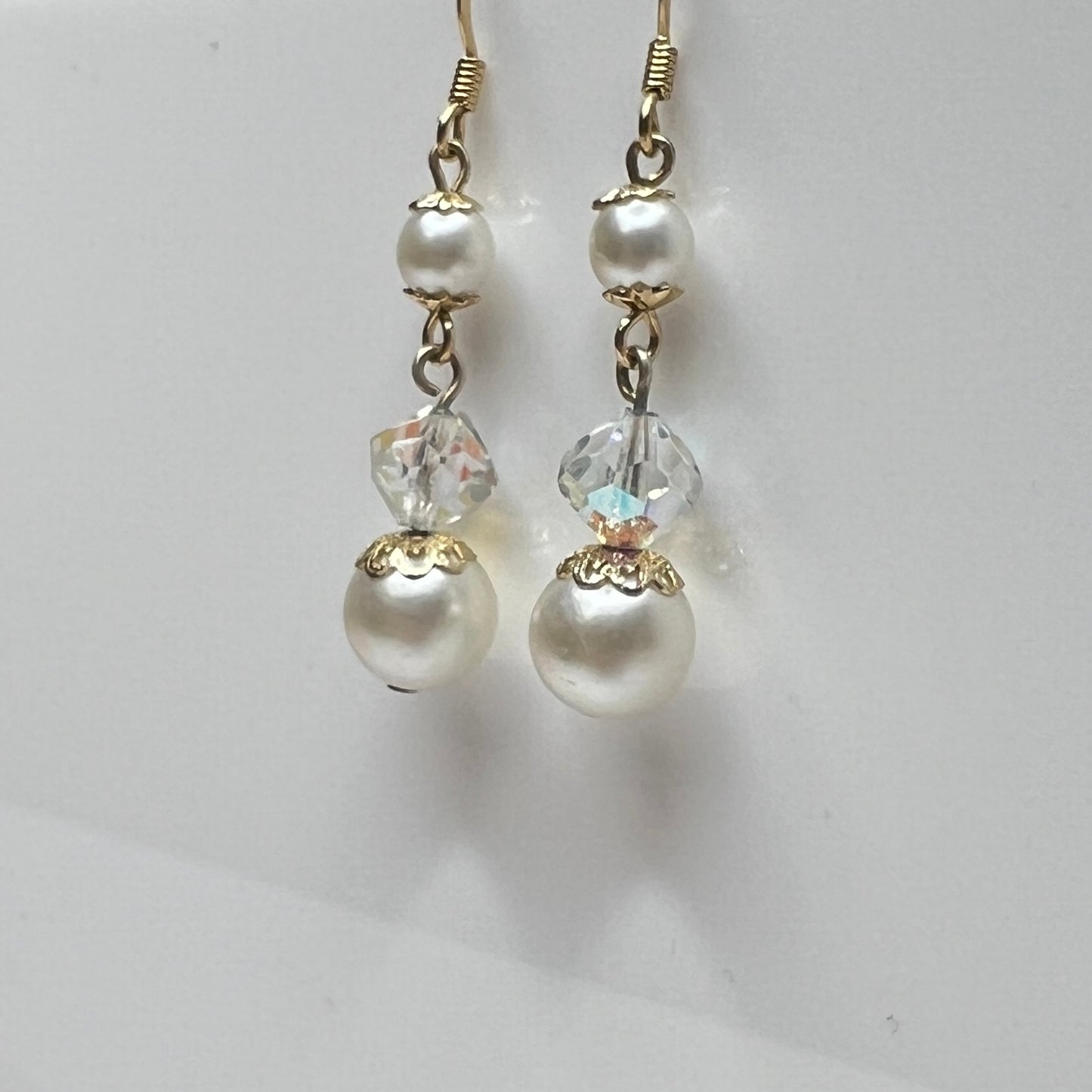 Gold-tone dangle earrings with faux pearls and faceted aurora borealis crystals, vintage 1960s