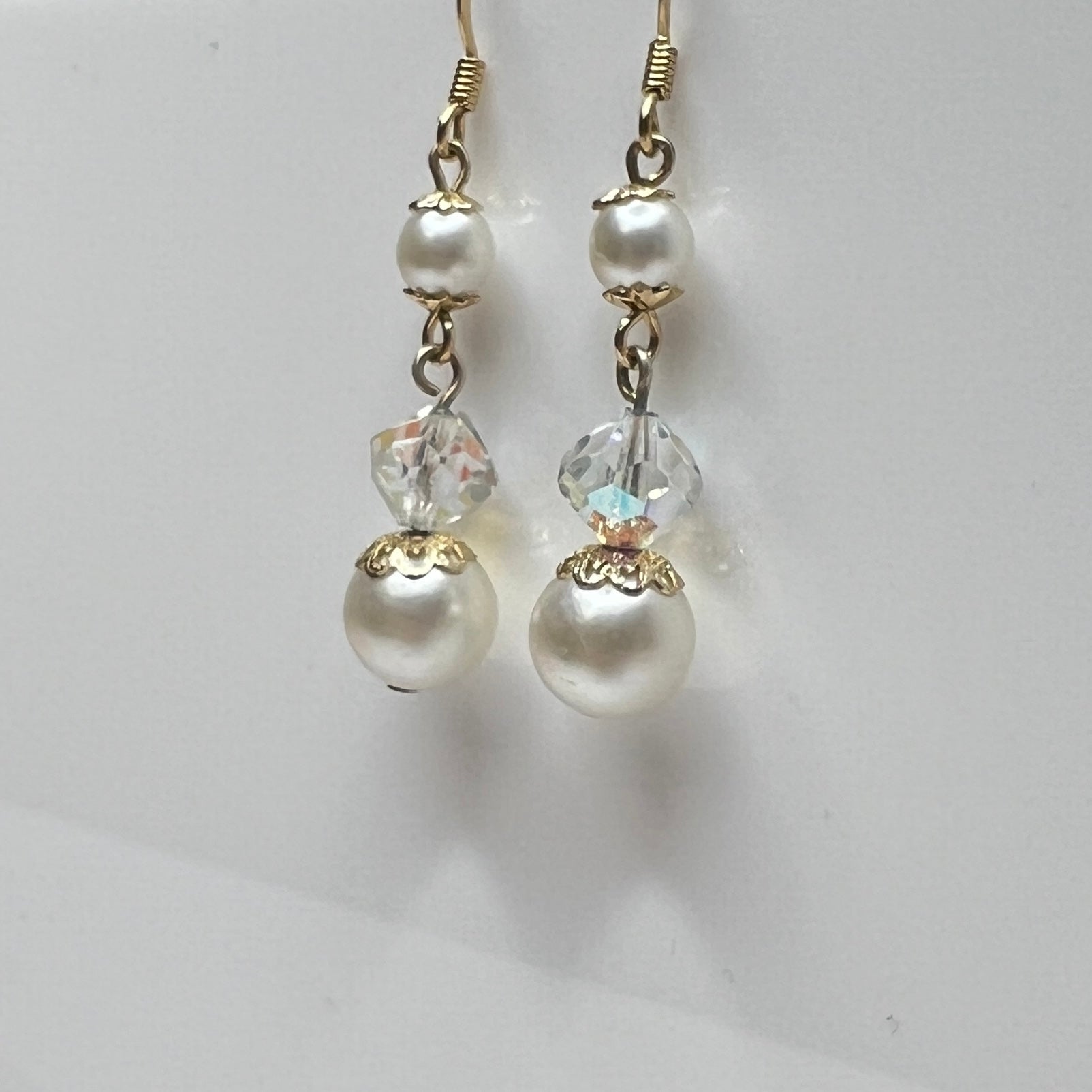 Gold-tone dangle earrings with faux pearls and faceted aurora borealis crystals, vintage 1960s