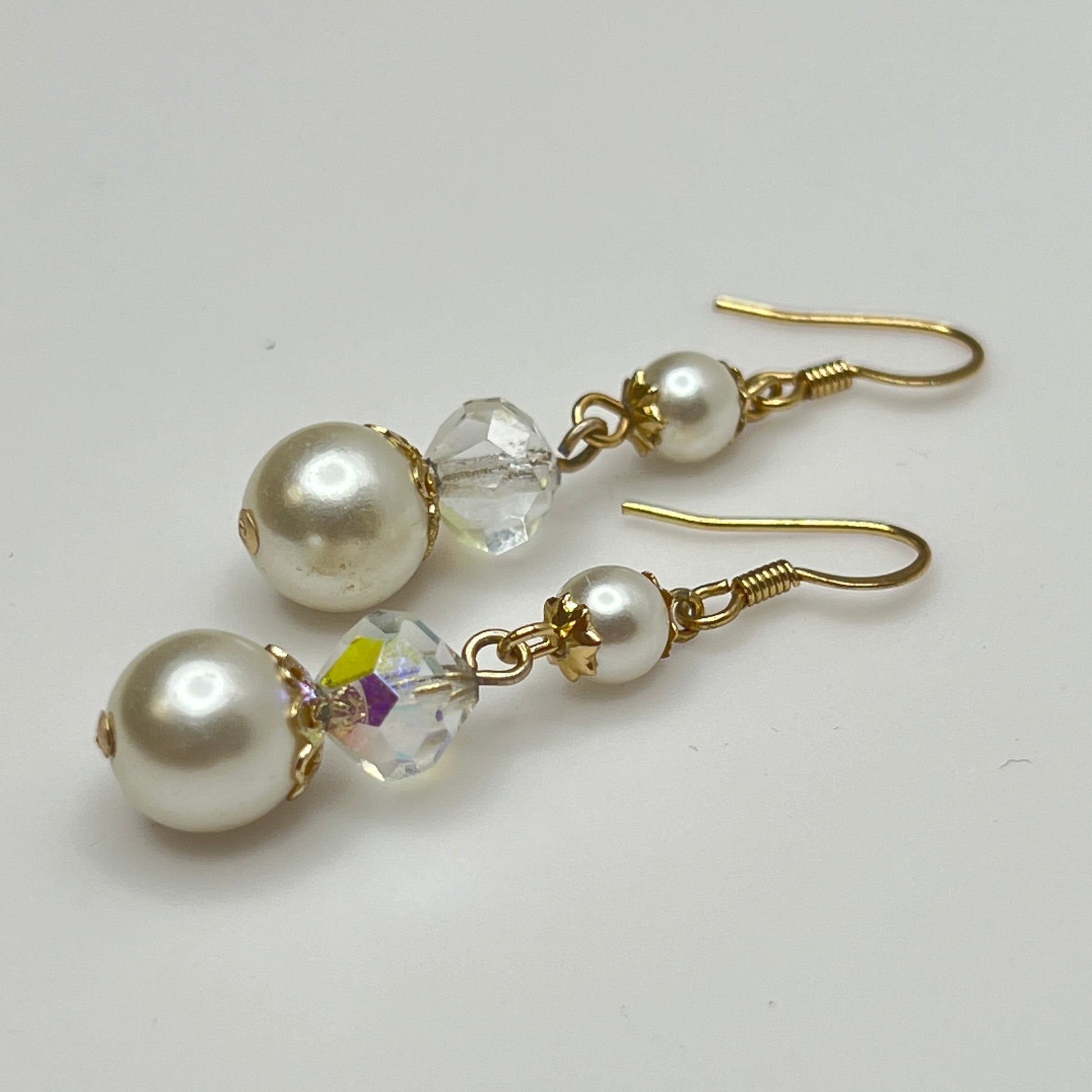 Gold-tone dangle earrings with faux pearls and faceted aurora borealis crystals, vintage 1960s
