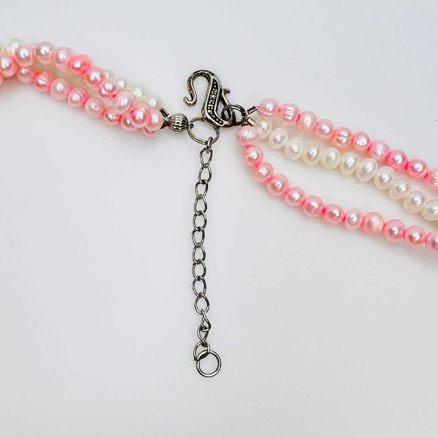 Silver tone hook clasp and adjustable extender chain on artisan pearl necklace