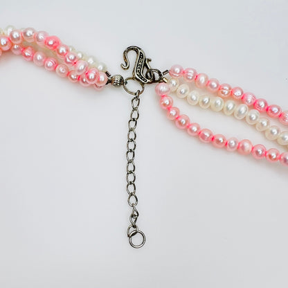 Silver tone hook clasp and adjustable extender chain on artisan pearl necklace