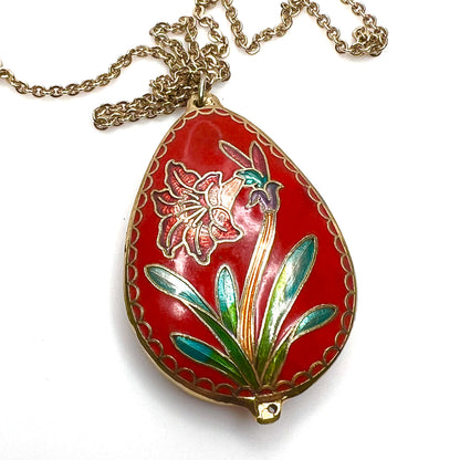 Reverse close-up of vintage cloisonné floral pendant in red enamel