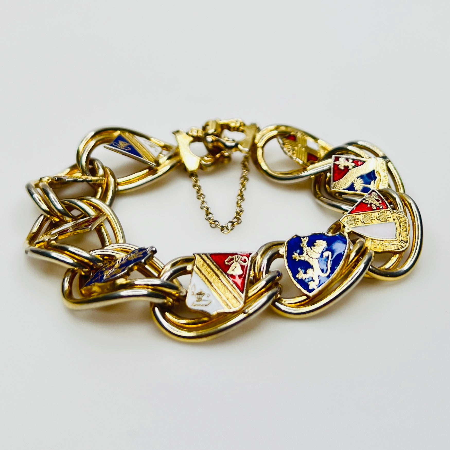 Side view of vintage enamel crest chain bracelet
