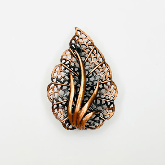 Vintage 1970s copper openwork leaf brooch with raised curved vein details
