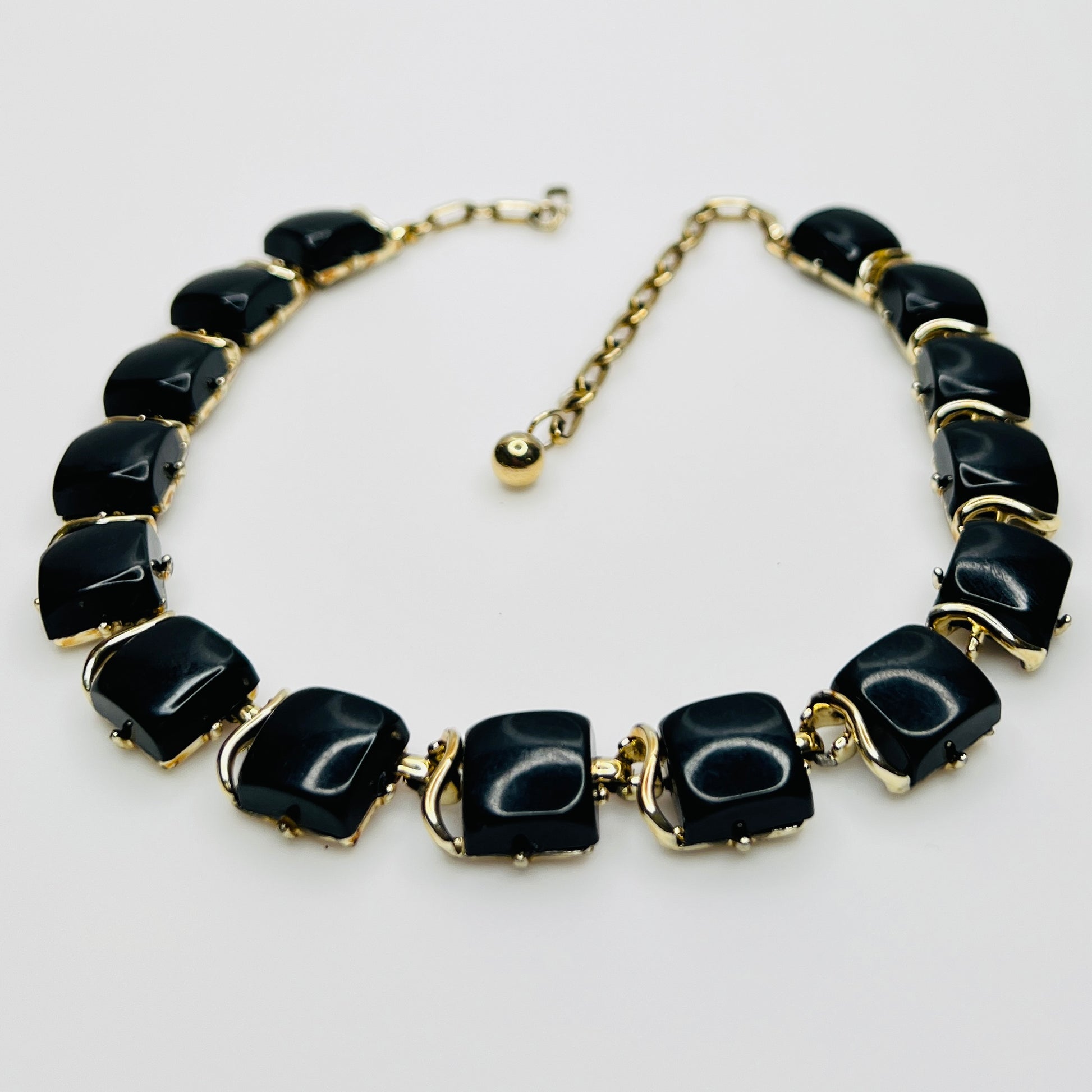 Close-up glossy black thermoset lucite links