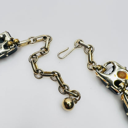 Gold tone extension chain hook clasp detail