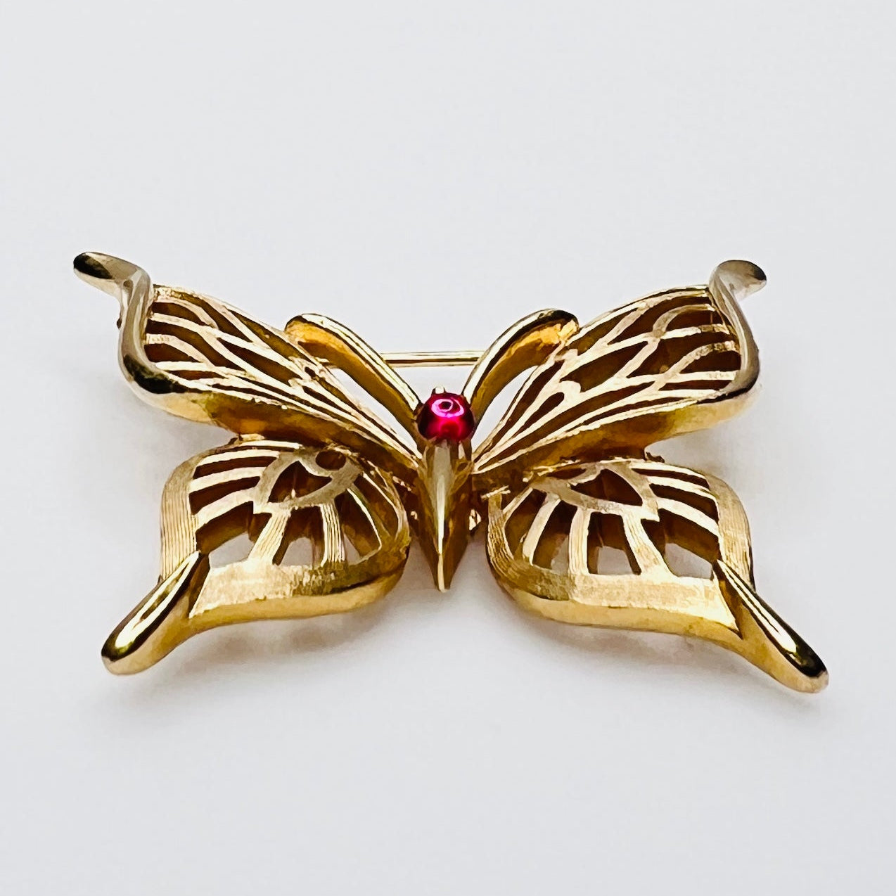 1970s Trifari butterfly pin with red cabochon