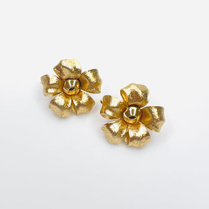 Vintage Crown Trifari gold flower clip-on earrings with sculpted petals.