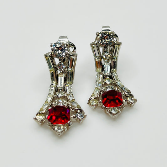 Close-up of 1950s dangle earrings with baguette and round rhinestones