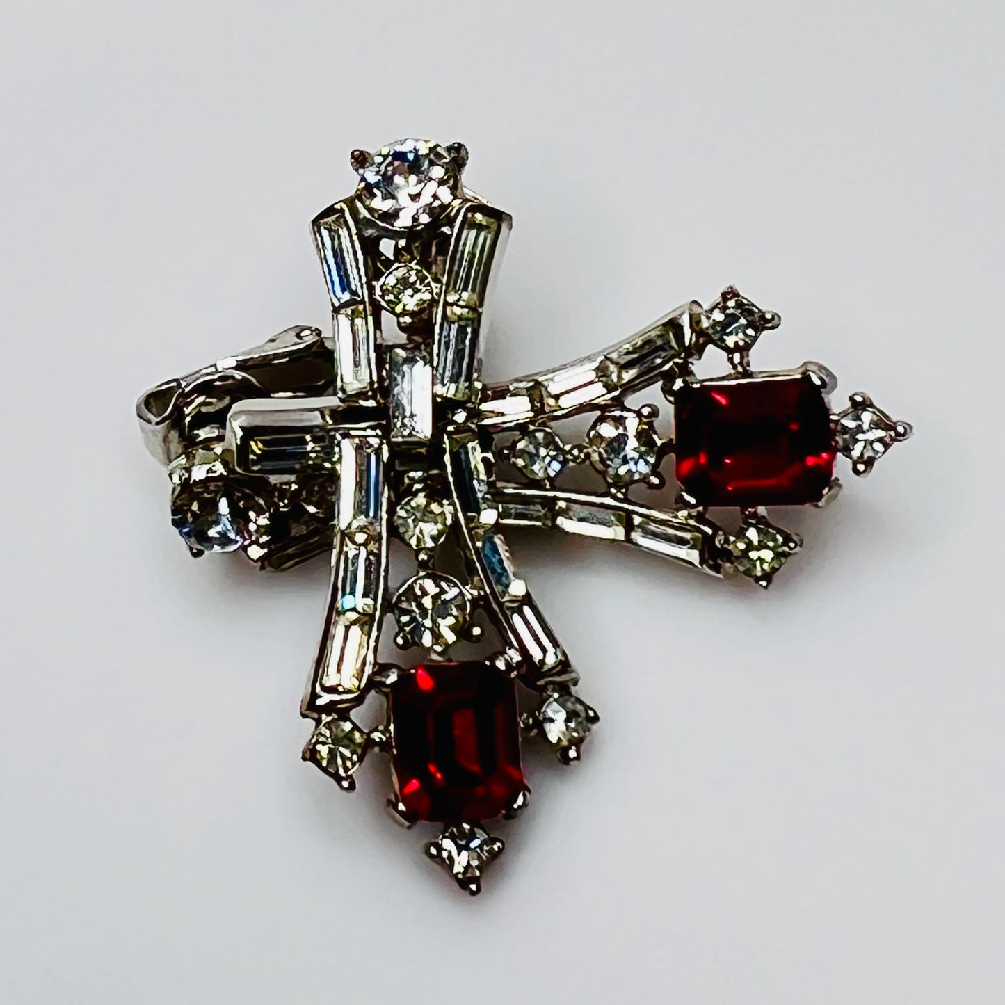 Close-up of 1950s dangle earrings with baguette and round rhinestones
