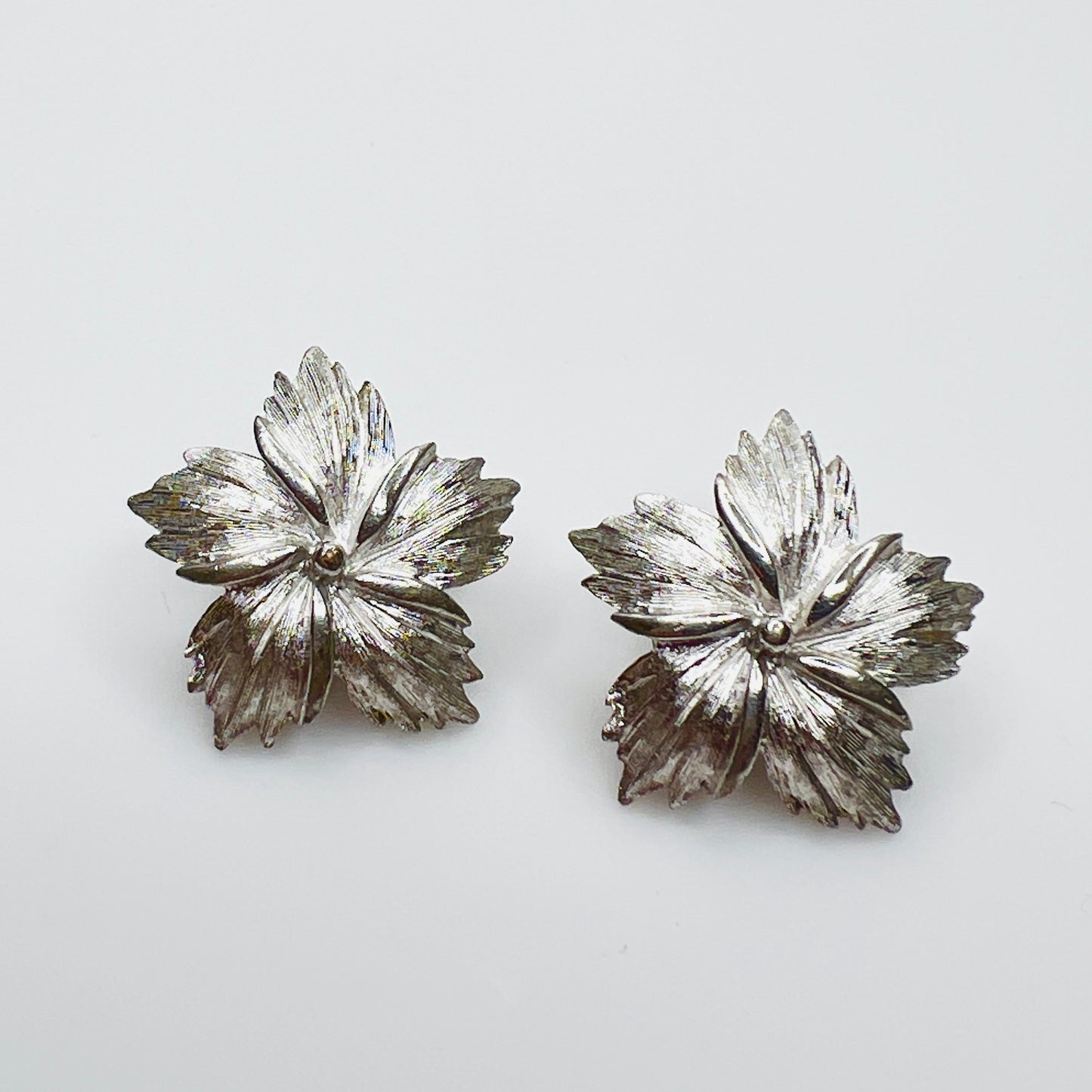 Vintage Crown Trifari silver tone flower clip on earrings