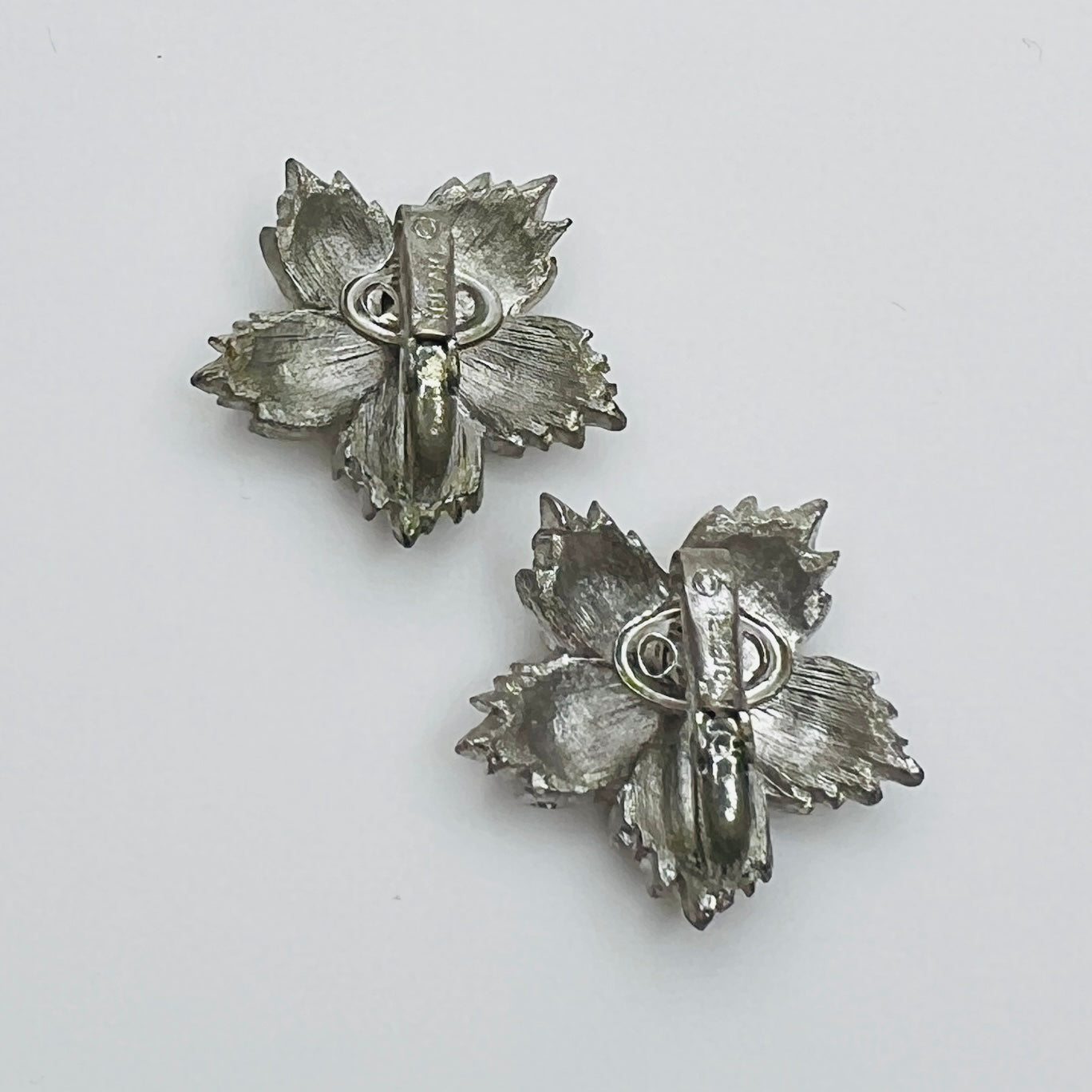 Back of signed Crown Trifari clip on earrings