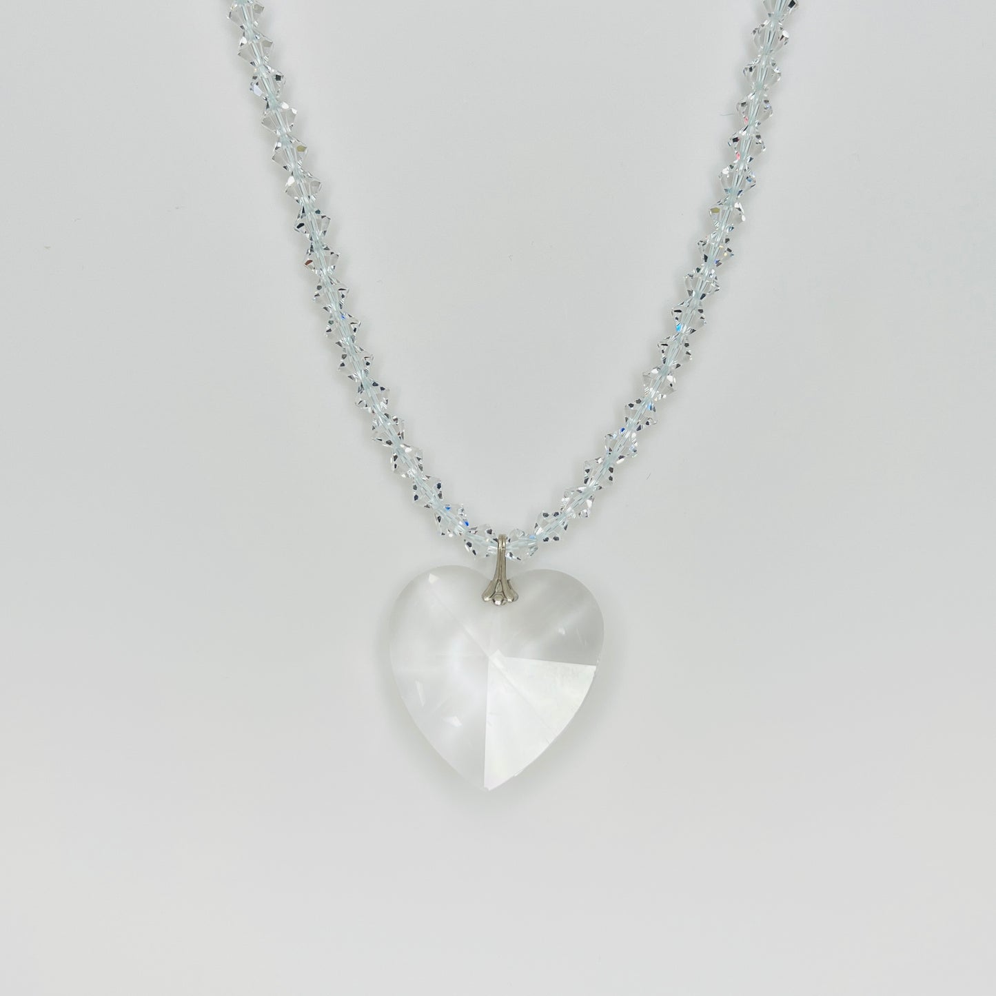 Vintage crystal heart pendant necklace with faceted clear crystal heart and sparkling crystal bicone bead strand