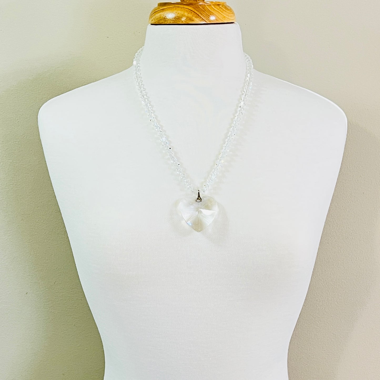 Large faceted crystal heart necklace with clear crystal bicone beads and gold tone box clasp