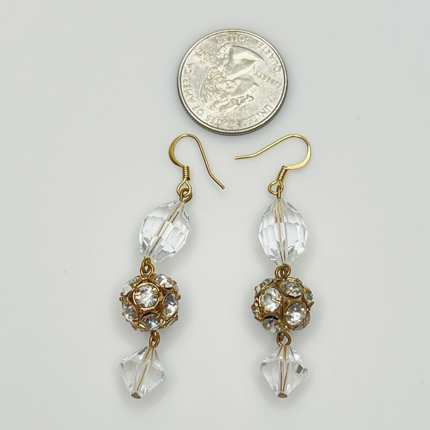 Clear oval crystal, rhinestone ball, and bicone crystal drop earrings