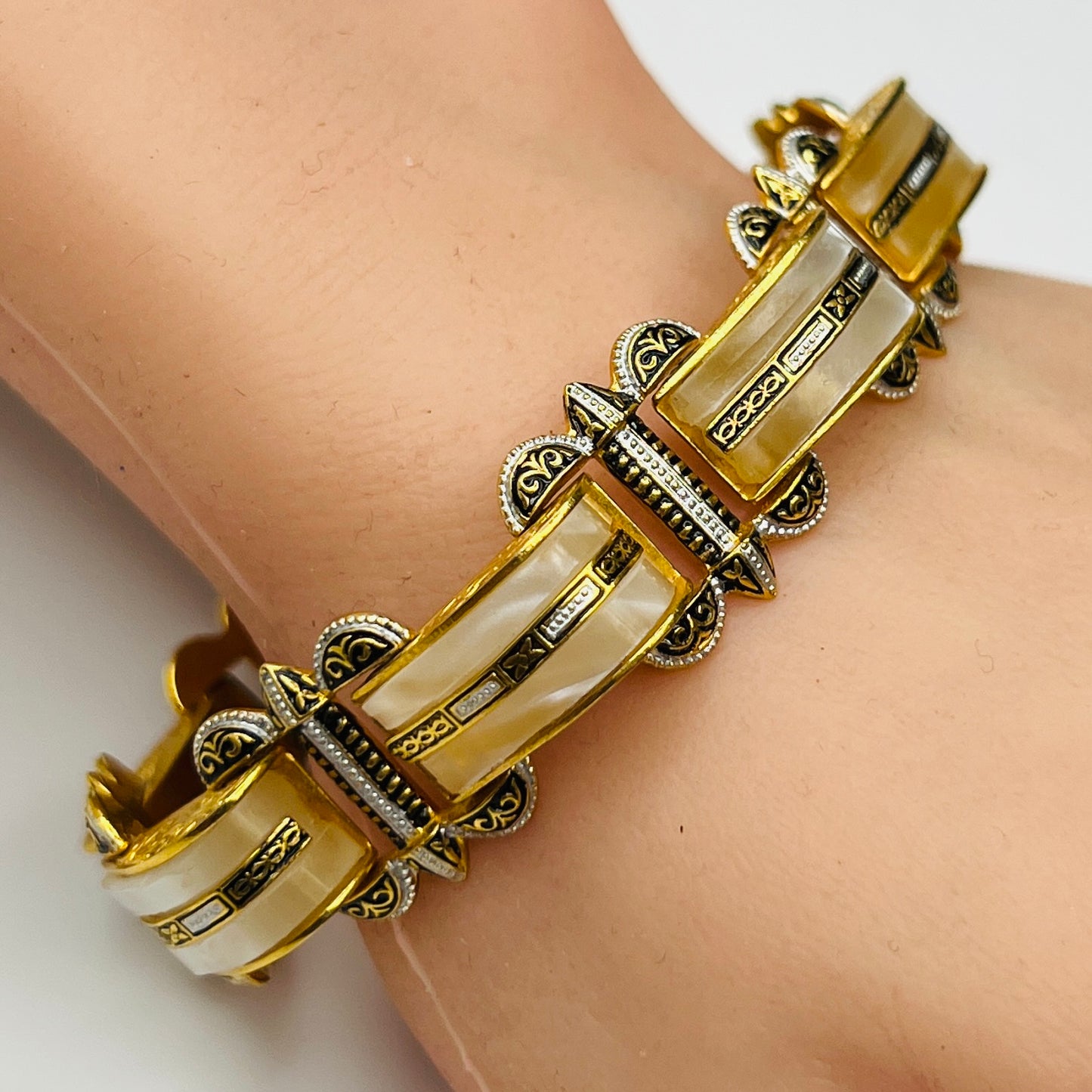Vintage Damascene and faux mother-of-pearl bracelet shown worn on wrist