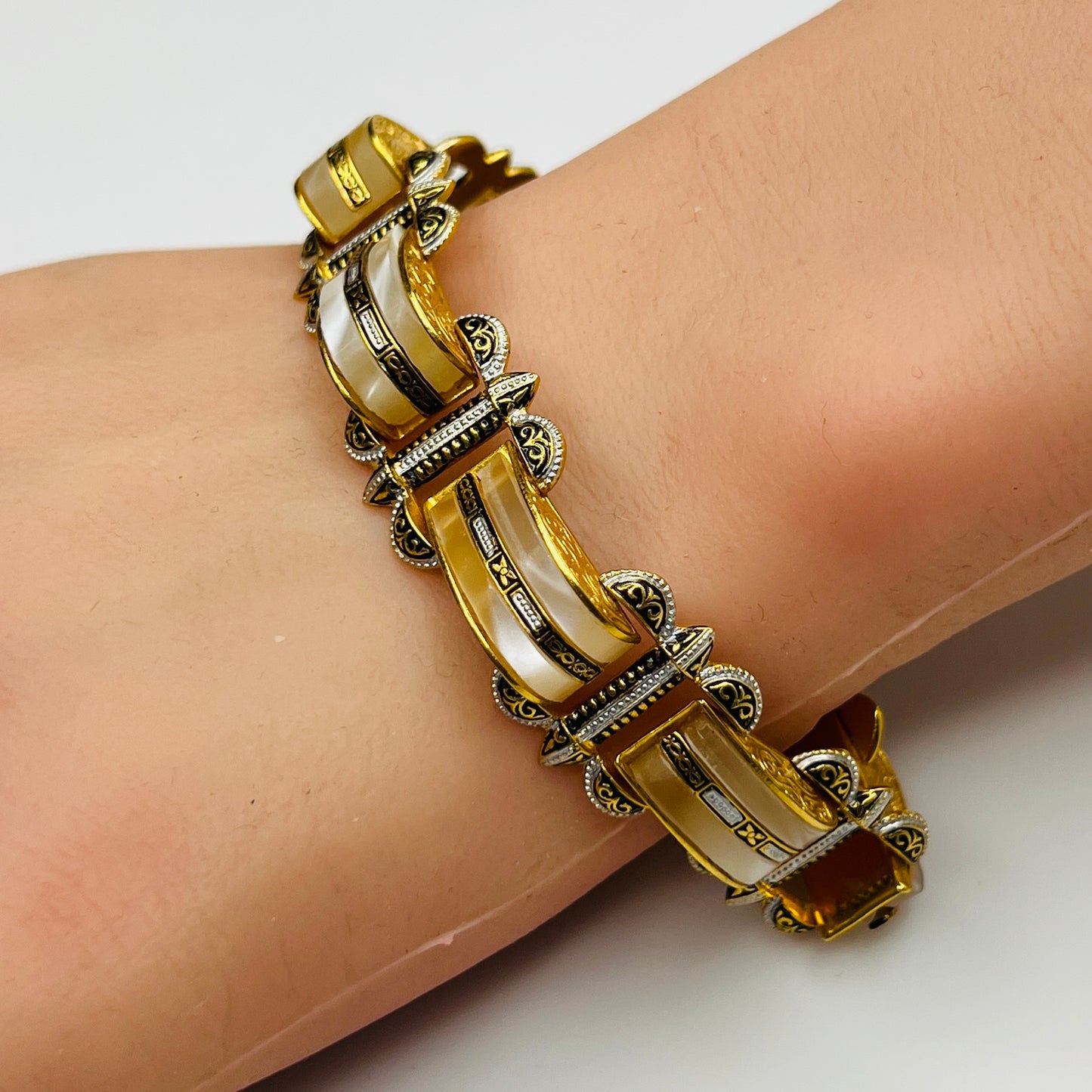 Vintage Damascene and faux mother-of-pearl bracelet shown worn on wrist