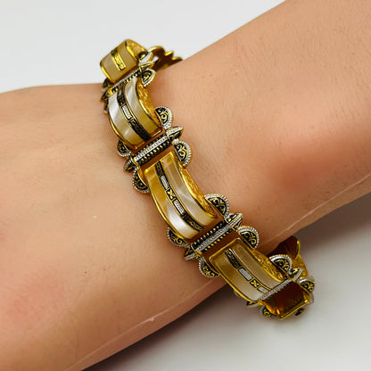 Vintage Damascene and faux mother-of-pearl bracelet shown worn on wrist