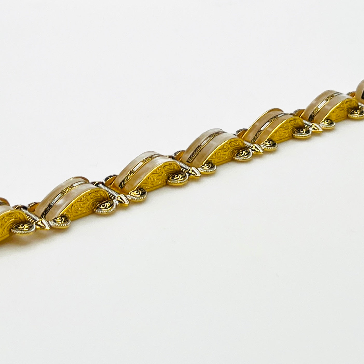 Side view of vintage Damascene panel link bracelet with ornate detailing
