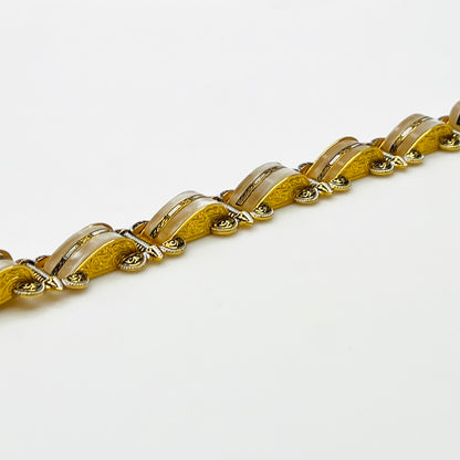 Side view of vintage Damascene panel link bracelet with ornate detailing
