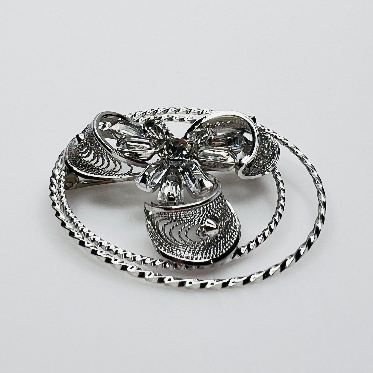 Side view showing dimensional crystal flower and silver loops