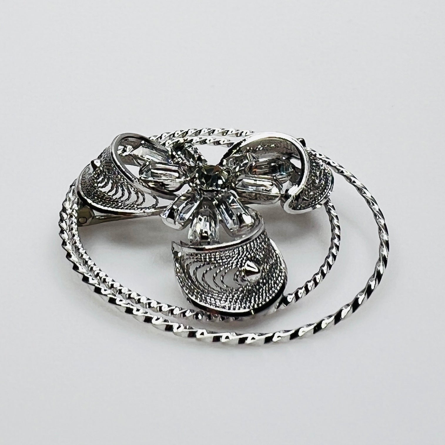 Side view showing dimensional crystal flower and silver loops