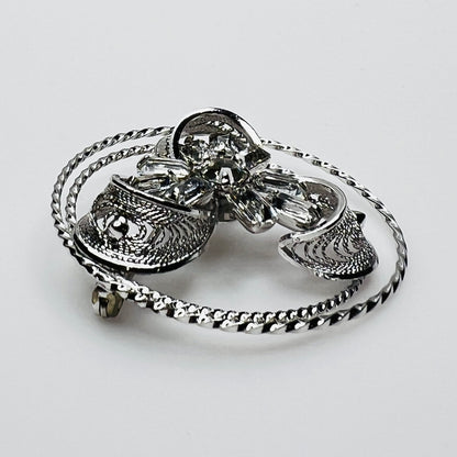 Side view showing dimensional crystal flower and silver loops