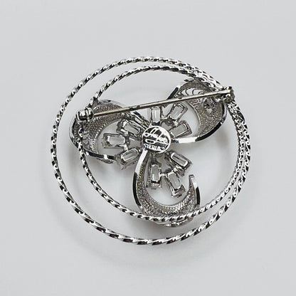 Back view showing dimensional crystal flower and silver loops