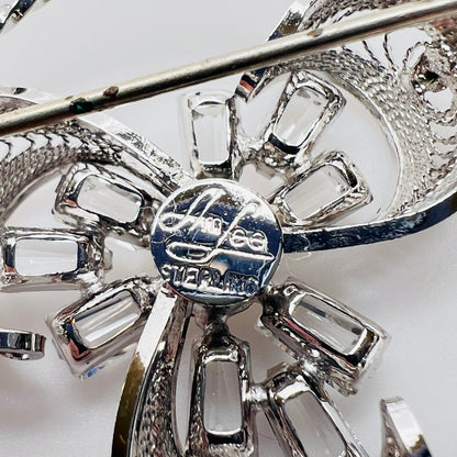Close-up of Ann Lee signature and sterling mark on brooch